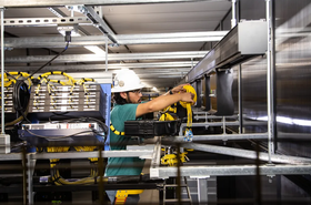 Fiber technician working in a Meta data center