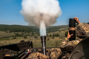 US Army fires a High Explosive 120mm mortar round during Exercise Saber Guardian 16