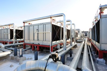 Sets of cooling towers in data center building