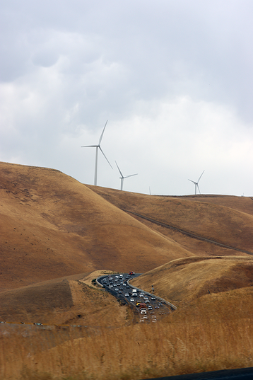 wind turbine farm renewable fields road car